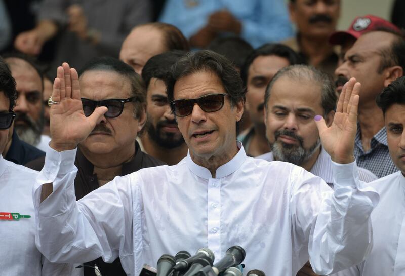 Imran Khan speaks to the media after casting his vote at a polling station during the general election in Islamabad on July 25. AFP