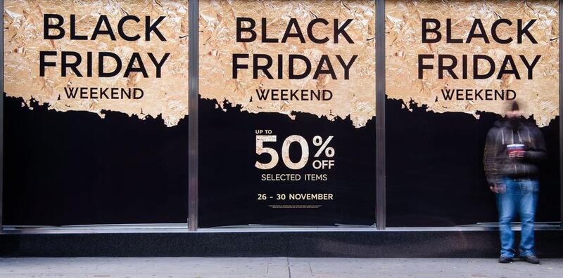 Retail stores display "Black Friday" advertisements and banners on Oxford Street in central London (AFP PHOTO / OLI SCARFF)