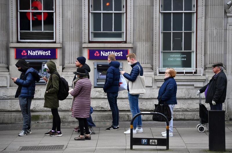 People queue for a supermarket, as the spread of the coronavirus disease (COVID-19) continues, in London, Britain, March 20, 2020. REUTERS/Dylan Martinez