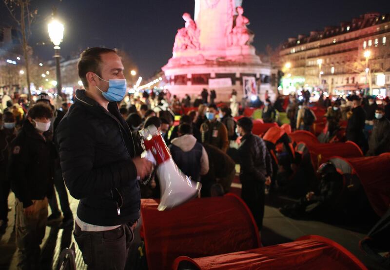 The Place de la Republique was full of people pitching tents shortly before the night-time curfew started in the French capital. EPA
