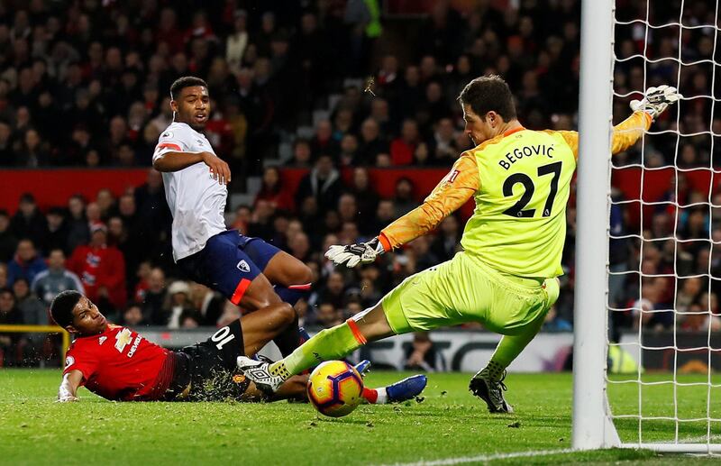 Manchester United's Marcus Rashford scores their third goal past Bournemouth's Asmir Begovic. Reuters