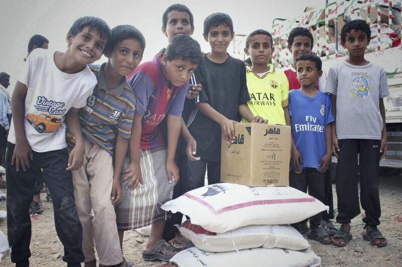 Emirates Red Crescent distributes emergency food aid in the Shabwa Governorate of Yemen on Monday. Wam