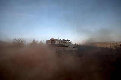 An Israeli Merkava tank at an undisclosed location along the border with Lebanon last week. EPA