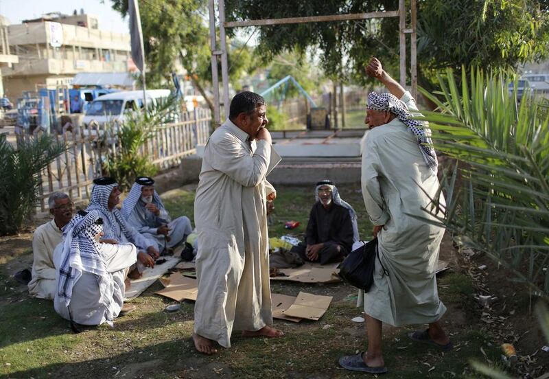 Iraqi Shi’ite men relax in Sadr City.