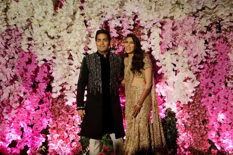 Akash Ambani with wife Shloka poses during their wedding reception in Mumbai, India, Sunday, March. 10, 2019. Photo: AP