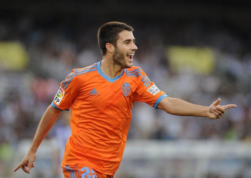 Carles Gil celebrates his goal for Valencia in their draw against Real Sociedad on Sunday in La Liga. Ander Gillenea / AFP / September 28, 2014