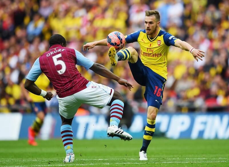 Aaron Ramsey, right, and Arsenal had the upper hand over Jores Okore’s Aston Villa last night. Shaun Botterill / Getty Images