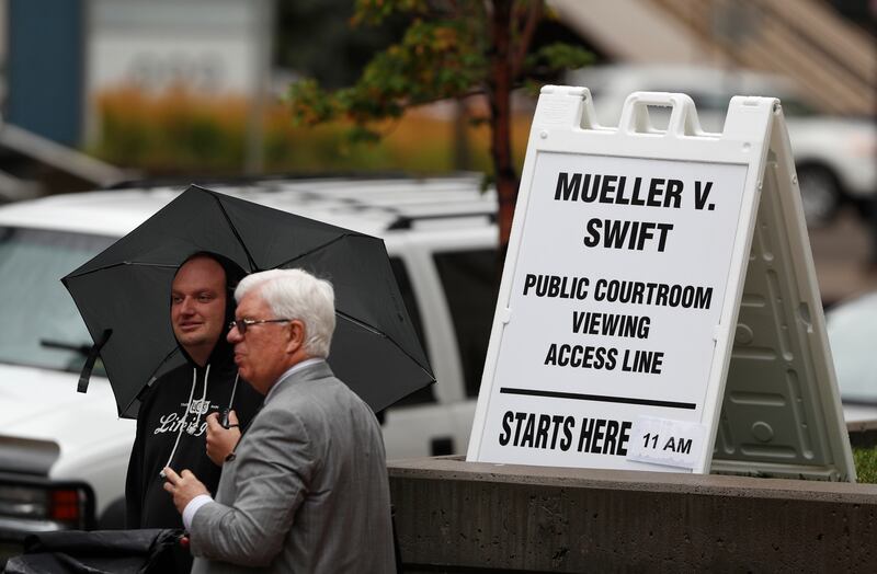 Members of the public Arthur Lewis, left, and Bruce Conant, both of Denver, wait to attend the jury selection phase in a civil trial to determine whether a radio host groped pop singer Taylor Swift as the case opens in federal court Monday, Aug. 7, 2017, in Denver. (AP Photo/David Zalubowski)