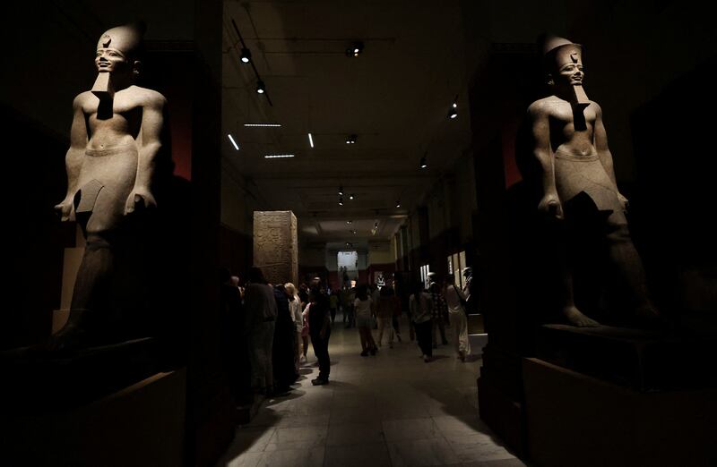 Some exhibits inside the Egyptian Museum in Cairo tower over visitors. Reuters