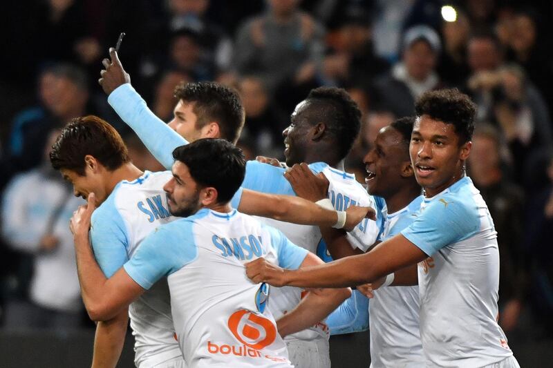 Balotelli calls his teammates over for the selfie after scoring. AFP