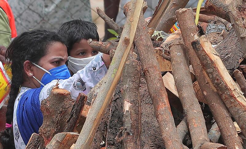 Santoshi performs rituals during the last rites in Suryapet. AP Photo