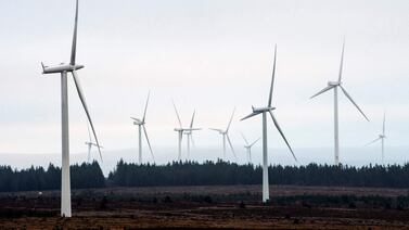 Wind turbines on Eaglesham Moor, south-west of Glasgow. Britain needs far more investment to help it hit net-zero targets. AFP