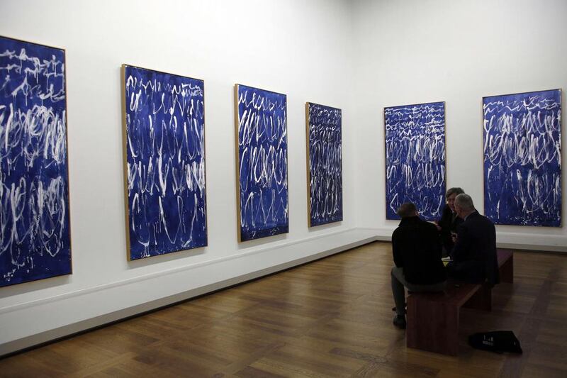 People look at the paintings of US artist Cy Twombly made in Italy in 2008. Francois Guillot/AFP