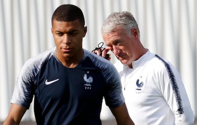 epa06888676 French player Kylian Mbappe (L) and head coach Didier Deschamps during a training session held in Moscow, Russia, 14 July 2018. France will face Croatia in FIFA World Cup 2018 final on 15 July 2018 in Moscow.  EPA/FELIPE TRUEBA