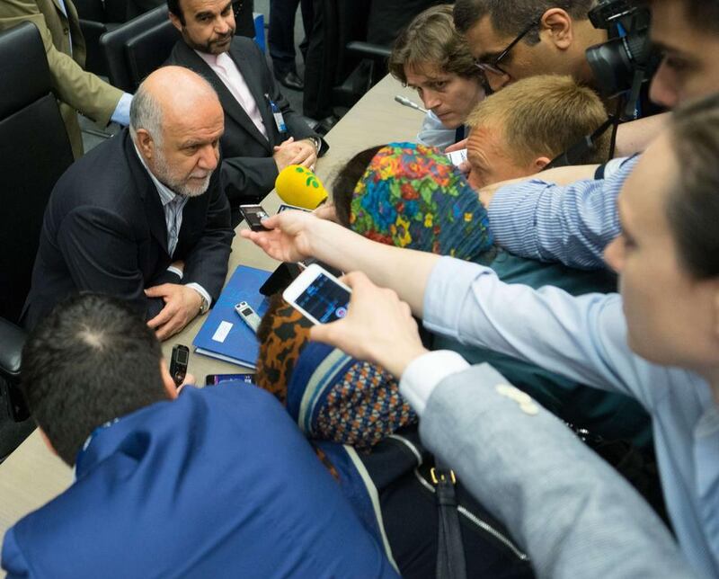 Iran’s minister of petroleum Bijan Zangeneh speaks to journalists prior to the start of an Opec meeting in Vienna, Austria. Opec has agreed to maintain its oil production ceiling at 30 million barrels per day. Joe Klamar / AFP