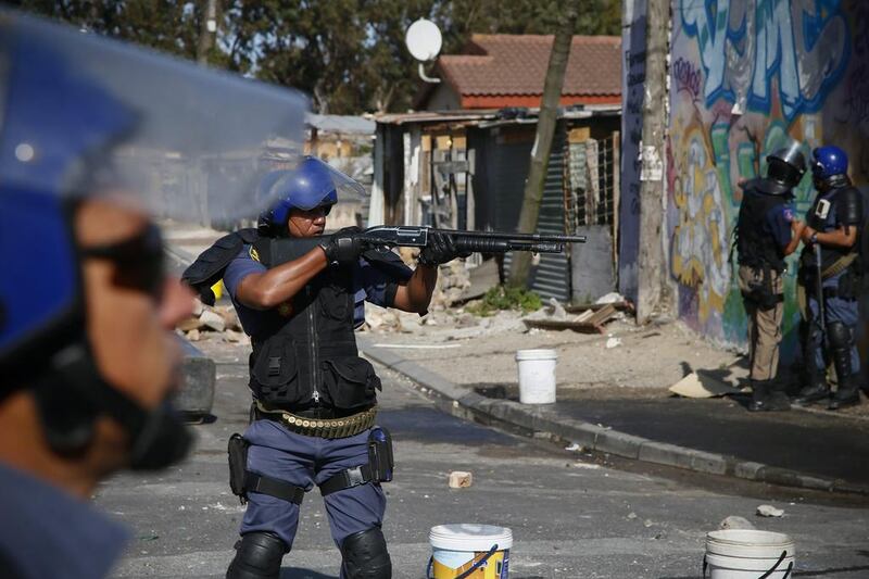 Police were deployed to the Philippi district of Cape Town, a city that suffers from regular gang violence and armed clashes between rival criminal groups. In this file photo, South African police fire rubber bullets to disperse residents of Masiphumelele during a protest against the police in Masiphumelele, Cape Town, South Africa. Nic Bothma / EPA