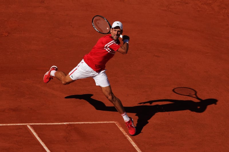 Novak Djokovic plays a forehand to Stefanos Tsitsipas. Getty