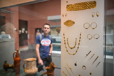 A display at the British Museum this week of Cypriot jewellery from about 1750BC. The museum launched an investigation into the theft of artefacts after discovering that stolen items were being sold on eBay for as little as £40.  Getty Images