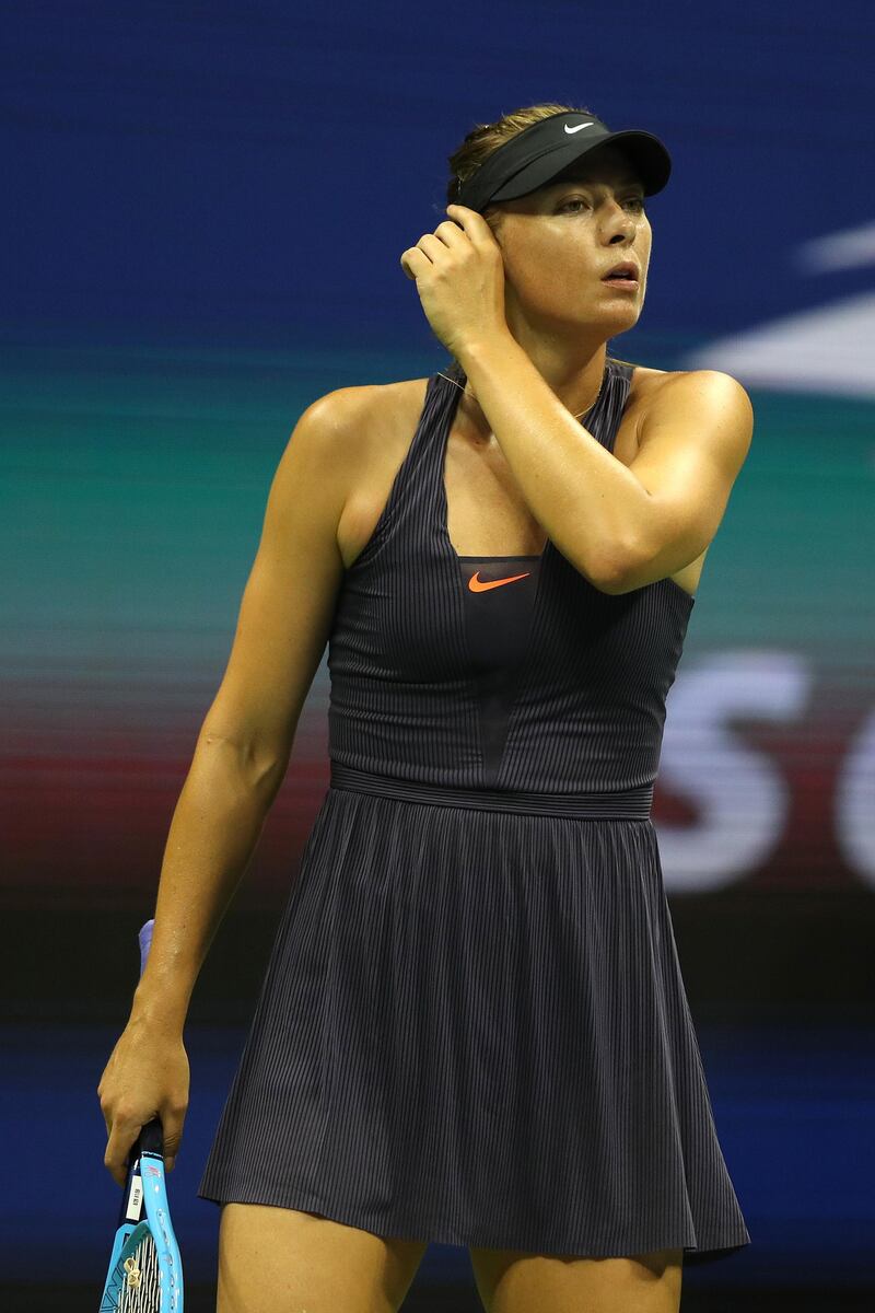 NEW YORK, NEW YORK - AUGUST 26: Maria Sharapova of Russia reacts during her Women's Singles first round match against Serena Williams of the United States during day one of the 2019 US Open at the USTA Billie Jean King National Tennis Center on August 26, 2019 in the Flushing neighborhood of the Queens borough of New York City.   Matthew Stockman/Getty Images/AFP