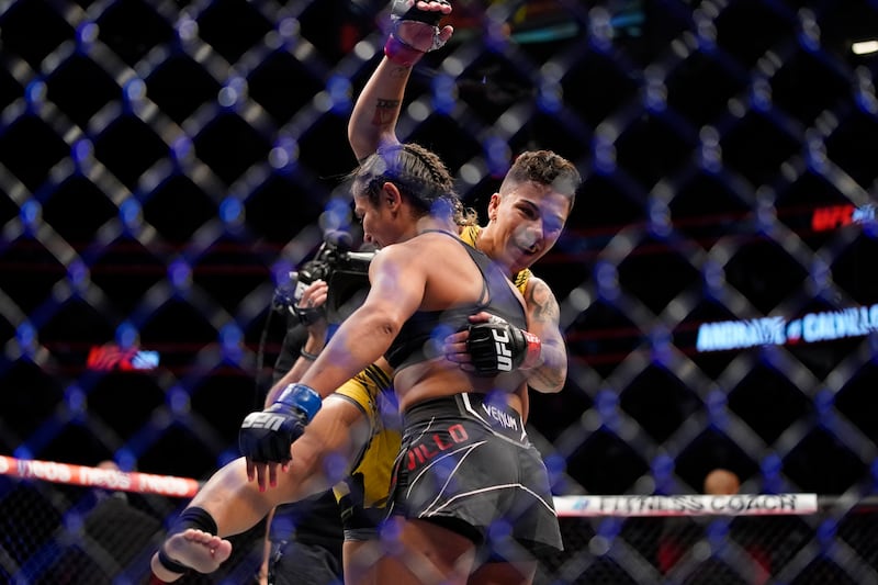 Jessica Andrade, right, celebrates after defeating Cynthia Calvillo during a women's flyweight mixed martial arts bout at UFC 266. AP Photo