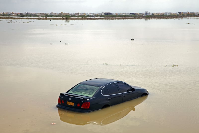 A car is stranded in flooded street in the Omani capital, Muscat. Photo: AFP