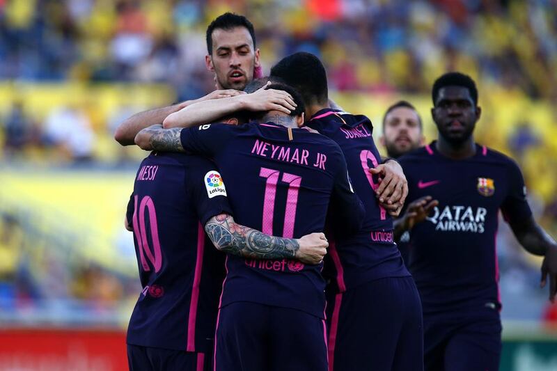 Barcelona forward Neymar celebrates with teammates after scoring the first goal against Las Palmas. Charlie Crowhurst / Getty Images