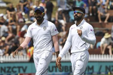 Jasprit Bumrah, left, Virat Kohli and the India squad were due to play four Test matches and three one-day internationals Down Under. AP 