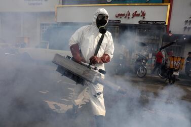 A firefighter disinfects a square against the new coronavirus, in western Tehran, Iran, Friday, March 13, 2020. The new coronavirus outbreak has reached Iran's top officials, with its senior vice president, Cabinet ministers, members of parliament, Revolutionary Guard members and Health Ministry officials among those infected. The vast majority of people recover from the new coronavirus. According to the World Health Organization, most people recover in about two to six weeks, depending on the severity of the illness. (AP Photo/Vahid Salemi)