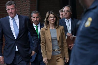 epaselect epa07483466 US actress Lori Loughlin (C) and her husband Mossimo Giannulli (2nd L) leave the John J Moakley Federal Court House after facing charges in a nationwide college admissions cheating scheme in Boston, Massachusetts, USA 03 April 2019.  EPA/KATHERINE TAYLOR QUALITY REPEAT