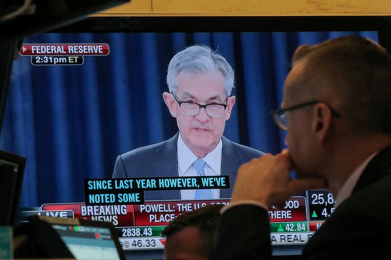 Federal Reserve chairman Jerome Powell is seen on a screen on the floor at the New York Stock Exchange. Higher consumer prices and a strong jobs market have led investors to push up expectations for how high the US central bank will raise rates and how long they will stay elevated. Reuters