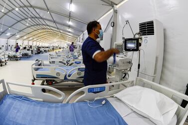Bahraini health sector experts set up patient monitoring equipment at the Sitra field Intensive Care Unit (ICU) hospital for Covid-19 patients, on May 4, 2020 in Sitra island south of the Bahraini capital Manama. AFP