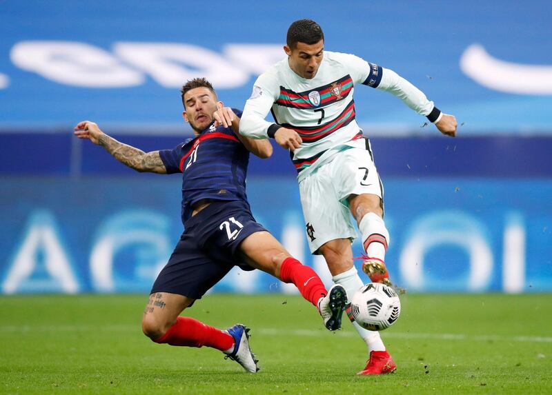 France's Lucas Hernandez in action with Portugal's Cristiano Ronaldo. Reuters