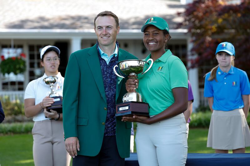 Maya Gaudin with Jordan Spieth after winning the Drive, Chip and Putt tournament at Augusta National. EPA