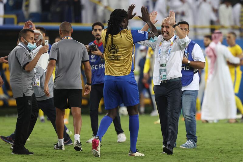 Al Hilal forward Bafetimbi Gomis celebrates the win with coach Leonardo Jardim. AFP