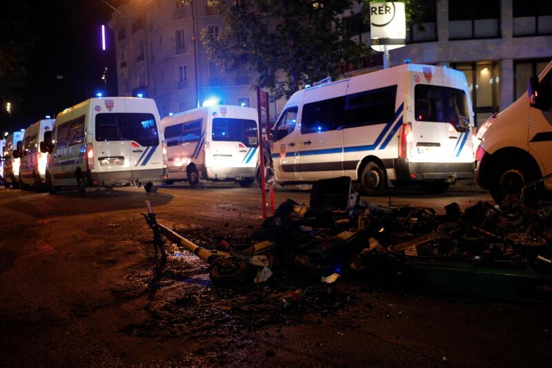 Destroyed electric scooters litter the pavement in Porte de Clichy. AFP