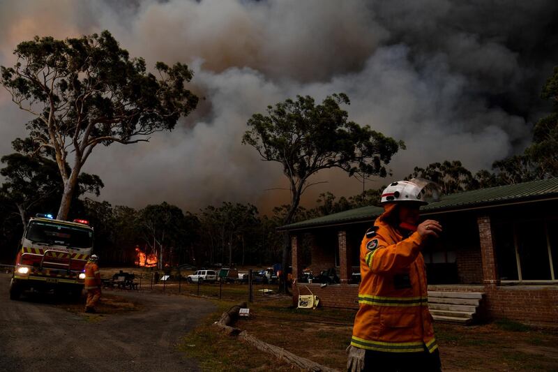 Rural Fire Service (RFS) firefighters conduct property protection near the town of Sussex Inlet in Sydney, Australia. Getty