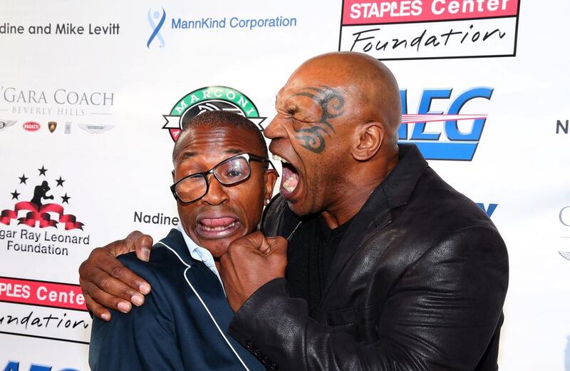 Actor/Comedian Tommy Davidson (L) and former professional boxer Mike Tyson attend the B. Riley & Co. and Sugar Ray Leonard Foundation’s 5th Annual “Big Fighters, Big Cause” Charity Boxing Night at the Santa Monica Pier in Santa Monica, California. Mark Davis / Getty