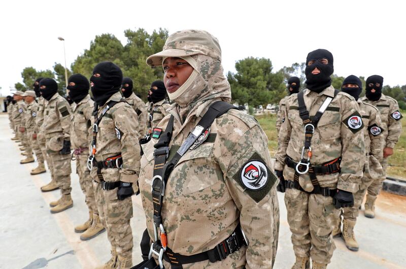 Members of Libyan special forces trained by the Turkish military, parade during a graduation ceremony in the coastal city al-Khums, about 120kms east of the capital Tripoli, on April 8, 2021. 

  / AFP / Mahmud TURKIA
