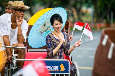 Singapore Airlines insist that female crew wear make up and sarongs in keeping with the brand image. Courtesy Singapore Airlines