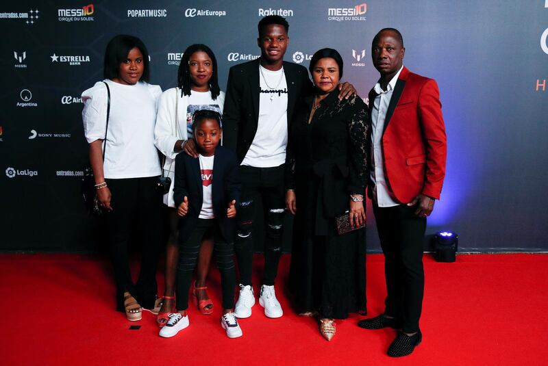 Barcelona's Ansu Fati poses with family members. Reuters