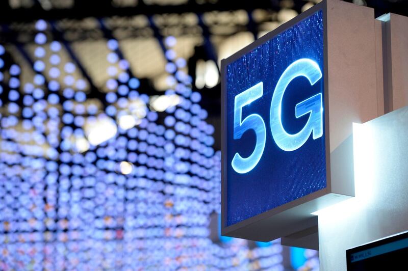 A 5G hotspot sign is displayed at the Mobile World Congress (MWC) in Barcelona on February 25, 2019. Phone makers will focus on foldable screens and the introduction of blazing fast 5G wireless networks at the world's biggest mobile fair starting February 25 in Spain as they try to reverse a decline in sales of smartphones. / AFP / Josep LAGO
