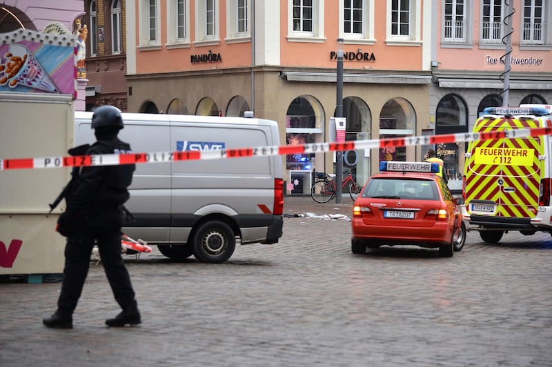 A square is blocked by the police in Trier, Germany, Tuesday, Dec. 1, 2020.  German police say two people have been killed and several others injured in the southwestern German city of Trier when a car drove into a pedestrian zone. Trier police tweeted that the driver had been arrested and the vehicle impounded. (Harald Tittel/dpa via AP)