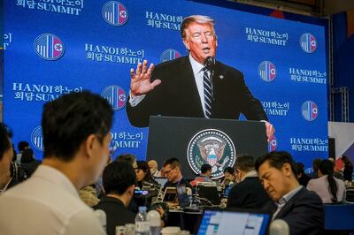 HANOI, VIETNAM - FEBRUARY 28: Journalists work at a media centre as the press conference by US President Donald Trump is telecasted following the second US-North Korea summit on February 28, 2019 in Hanoi, Vietnam. U.S President Donald Trump and North Korean leader Kim Jong-un abruptly cut short their two-day summit in Vietnam after failing to reach an agreement on nuclear disarmament. (Photo by Linh Pham/Getty Images)