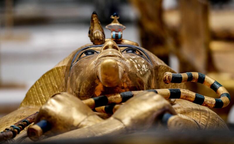 TOPSHOT - This picture taken on September 21, 2019 shows a view of the golden sarcophagus of the ancient Egyptian Pharaoh Tutankhamun (reigned between 1342-1325 BC) as it lies for restoration at the restoration lab of the newly-built Grand Egyptian Museum (GEM) in Giza on the southwestern outskirts of the capital Cairo.  / AFP / Mohamed el-Shahed
