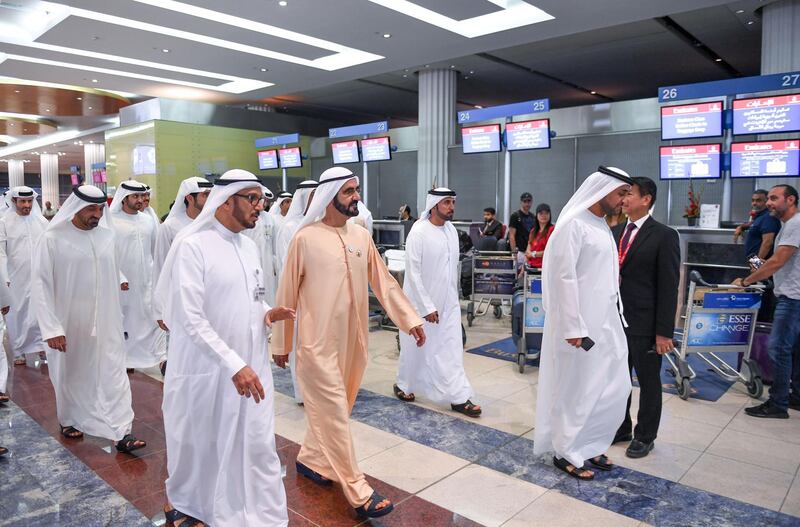 <p>Workers are stunned to see Sheikh Mohammed, Sheikh Hamdan and Sheikh Saeed&nbsp;walk through Dubai International Airport. Wam</p>
