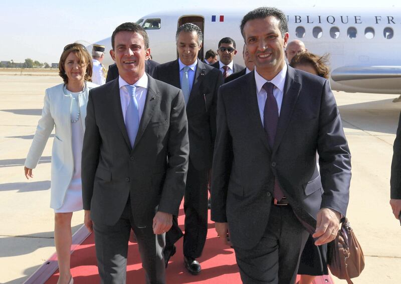 Jordanian Tourism Minister Nayef Al-Fayez (front R) walks with French Prime Minister Manuel Valls (front C) upon his arrival at Queen Alia International Airport in Amman, Jordan, October 11, 2015. REUTERS/Jamal Nasrallah/Pool
