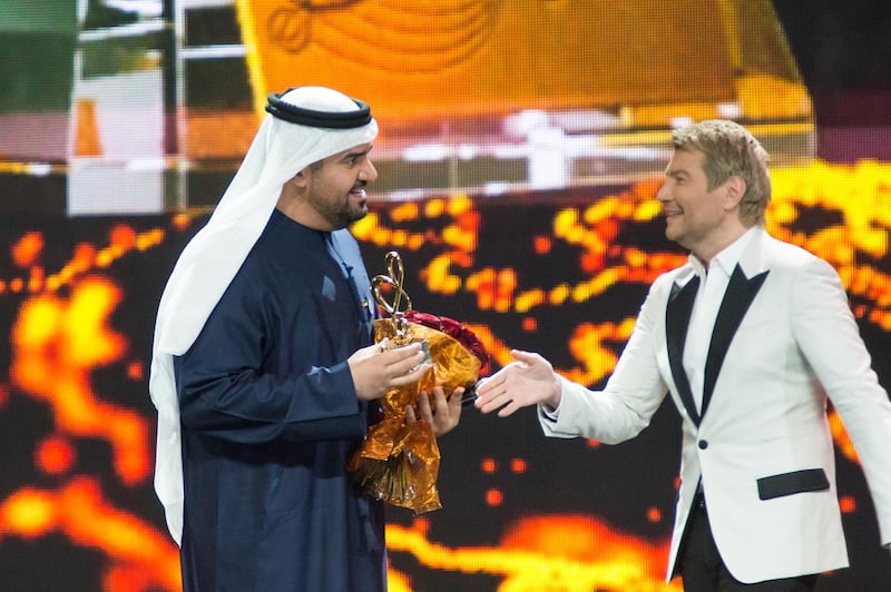 Hussain Al Jassmi receives the award for Best Middle East Artist from Nikolay Baskov at the Bravo awards in Moscow, Russia on Saturday night.