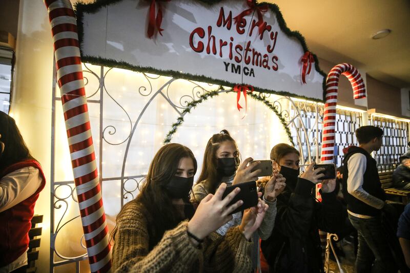 Gaza city residents get selfies at the Christmas event.