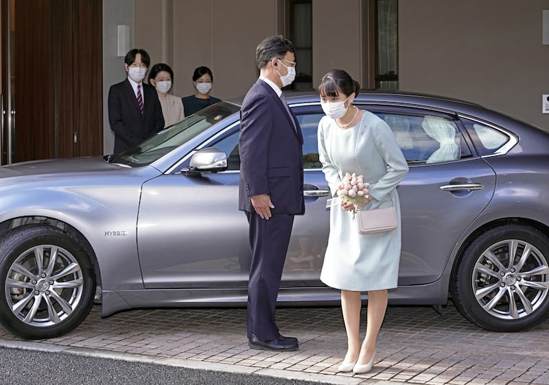 Princess Mako bows as she leaves her home in Tokyo, Japan. EPA