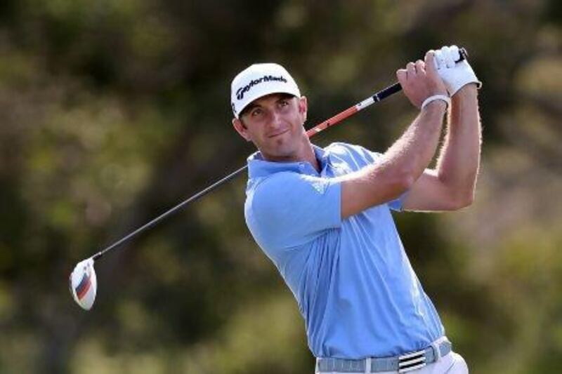 Dustin Johnson hits a tee shot on 18th hole during the final round of the Hyundai Tournament of Champions in Kapalua, Hawaii. Johnson won the tournament, which attracted only 30 players and was the US PGA Tour opener..